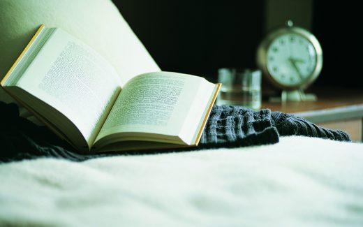 read a book under a blanket