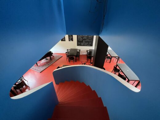 The iconic red and blue curved staircase